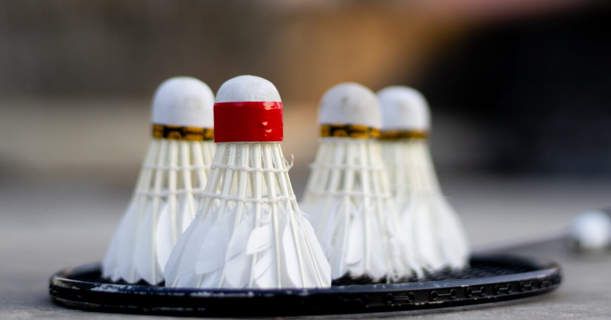 Close up shot of multiple shuttlecocks on a badminton raquet