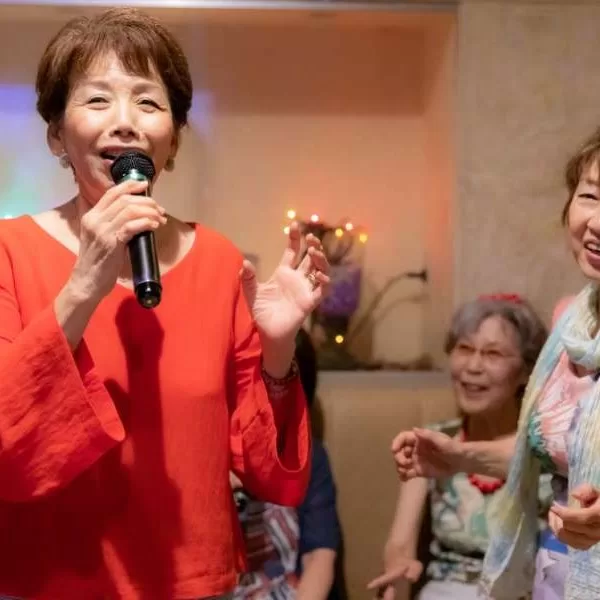 women singing karaoke
