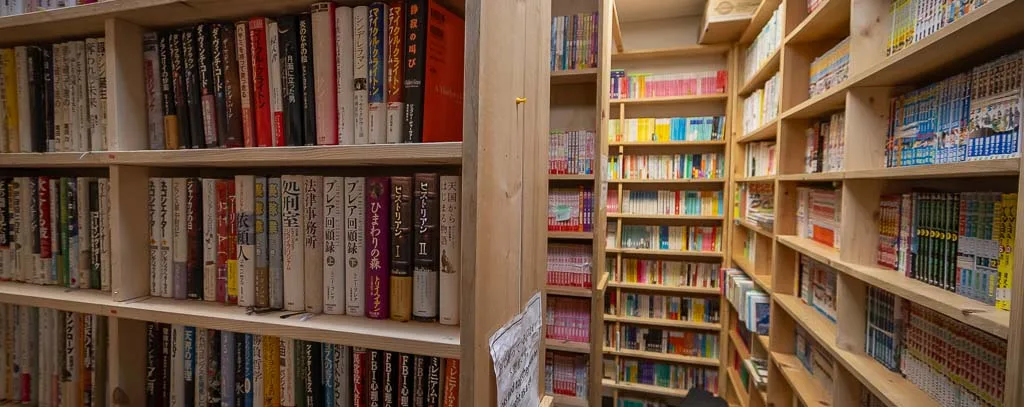 Bookcases with Japanese books for sale. Photo by Adam PW Smith.