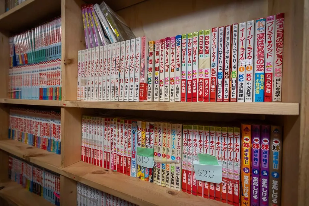 Bookshelf with manga for sale. Photo: Adam PW Smith