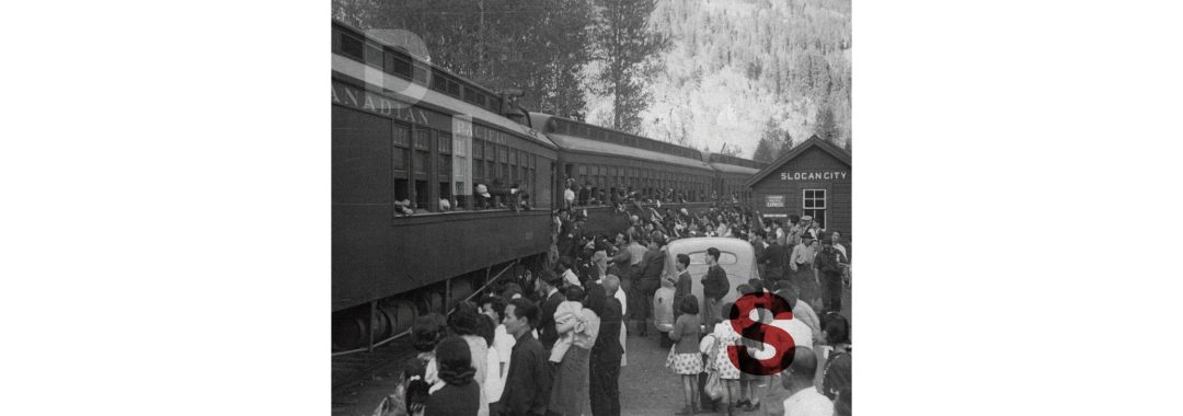 A grainy, black-and-white archival photograph of Japanese Canadians departing from the Slocan City train station. A large crowd on the platform waves to individuals leaning out of the windows of a Canadian Pacific passenger train. Large, stylized letters "D", "I", and "S" are superimposed over the scene in transparent white and bold red.