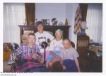Atsushi, Teruko, Michiyo and Masayuki Uyeda in Front of Piano; Nakusp, BC; 15 July 2001. Uyeda Family of Nakusp collection. NNMCC 2025.1.3.4.54.