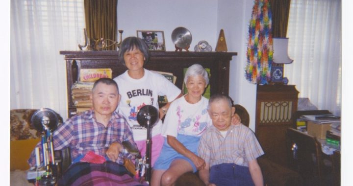 Atsushi, Teruko, Michiyo and Masayuki Uyeda in Front of Piano; Nakusp, BC; 15 July 2001. Uyeda Family of Nakusp collection. NNMCC 2025.1.3.4.54.